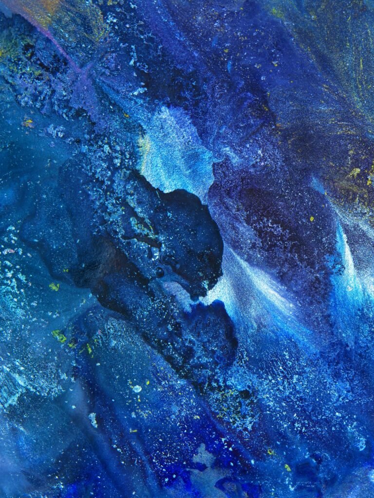 Dynamic and vibrant abstract painting with rich blue hues, showcasing fluid acrylic textures and artistic expression.